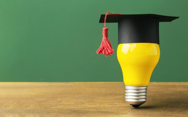 front-view-lightbulb-with-academic-cap-copy-space